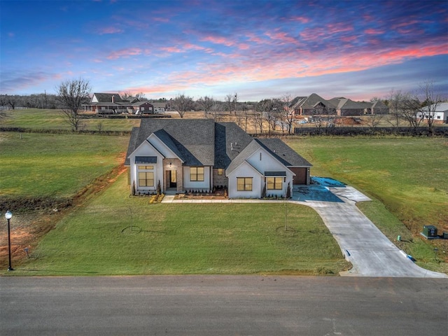 view of front of property with a lawn