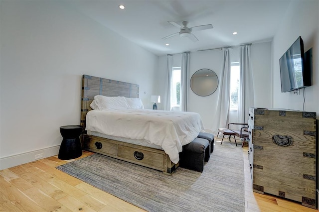 bedroom featuring ceiling fan and light hardwood / wood-style floors