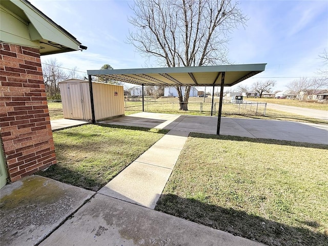 view of parking / parking lot featuring a carport and a lawn