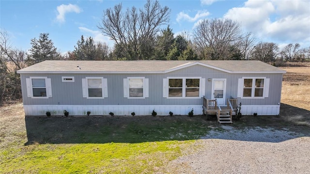 manufactured / mobile home with a front lawn