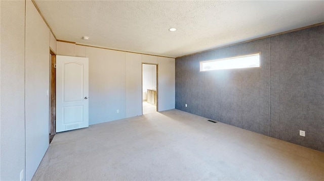 unfurnished bedroom featuring a textured ceiling