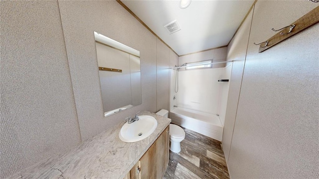 bathroom featuring vanity, wood-type flooring, and toilet