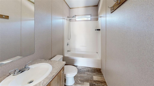 full bathroom with shower / bathing tub combination, vanity, toilet, and hardwood / wood-style floors