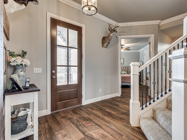 foyer featuring crown molding, dark hardwood / wood-style floors, and ceiling fan