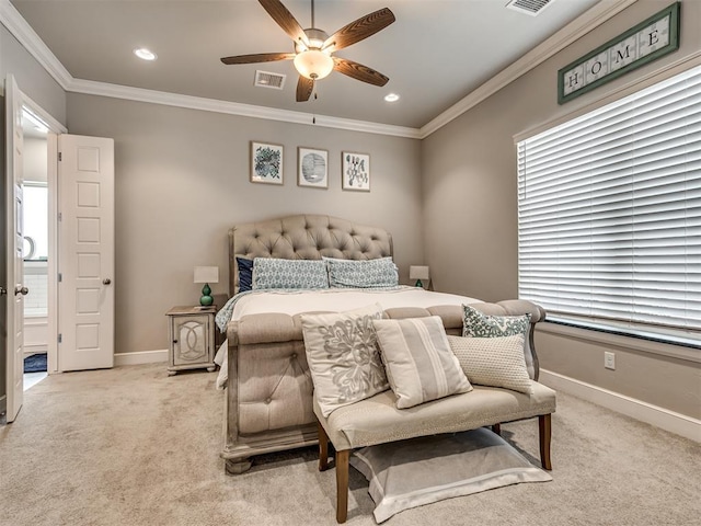 bedroom with ornamental molding, light colored carpet, and ceiling fan