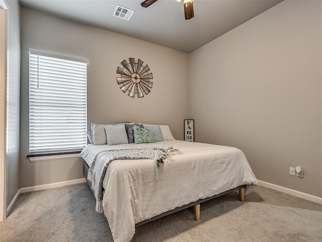 bedroom featuring ceiling fan and carpet