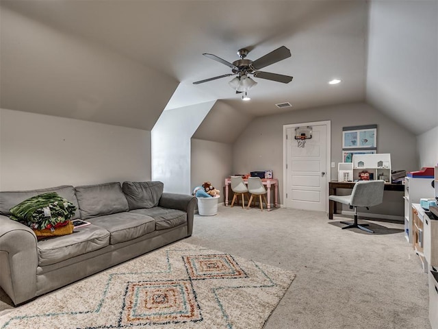 living room with ceiling fan, carpet floors, and vaulted ceiling