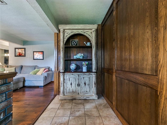 interior space with wood-type flooring and a textured ceiling