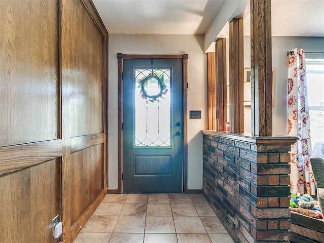 entrance foyer with light tile patterned floors