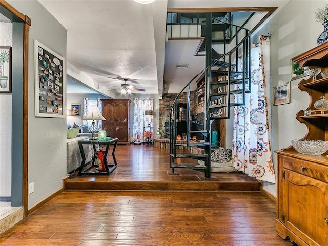 interior space featuring ceiling fan and hardwood / wood-style flooring