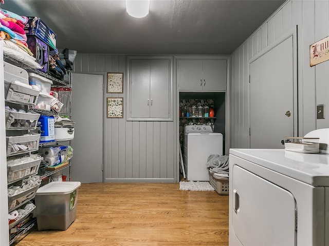 laundry room with light hardwood / wood-style flooring