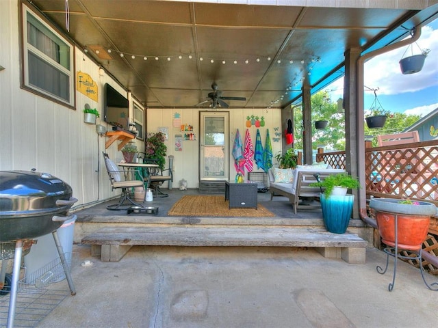 view of patio featuring ceiling fan and a grill