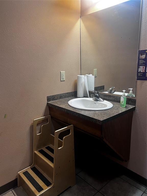 bathroom featuring tile patterned floors and vanity