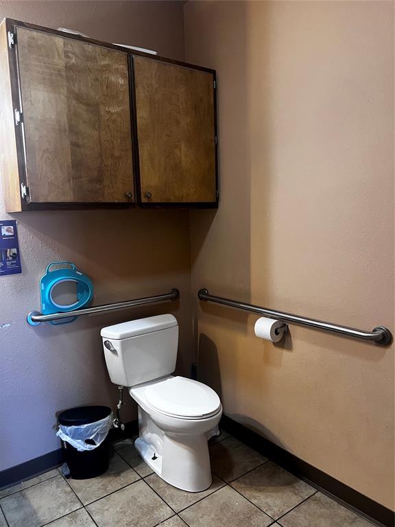 bathroom with tile patterned floors and toilet