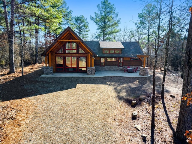 rear view of property with a patio area