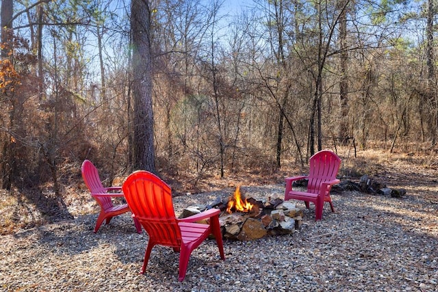 view of yard with an outdoor fire pit