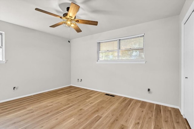 spare room with light hardwood / wood-style flooring and ceiling fan