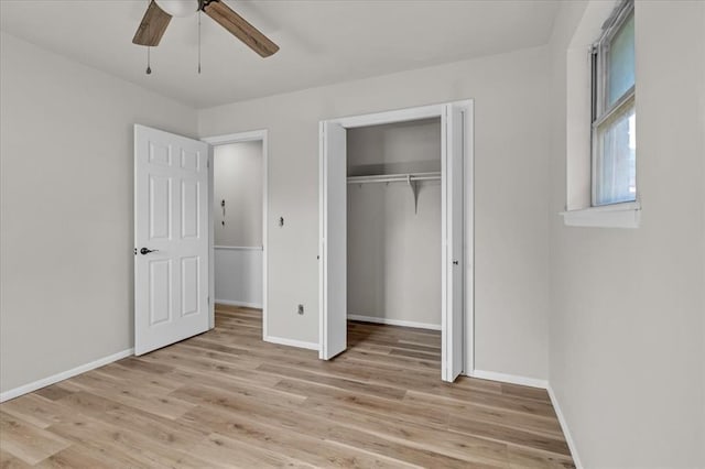 unfurnished bedroom featuring light wood-type flooring, a closet, and ceiling fan