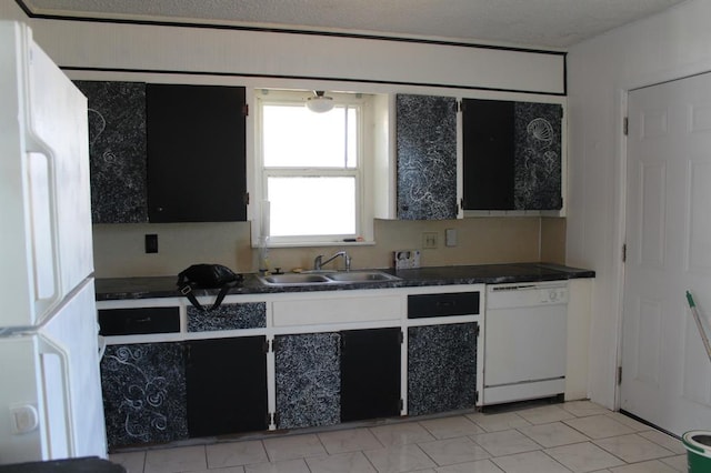 kitchen featuring sink, light tile patterned floors, and white appliances