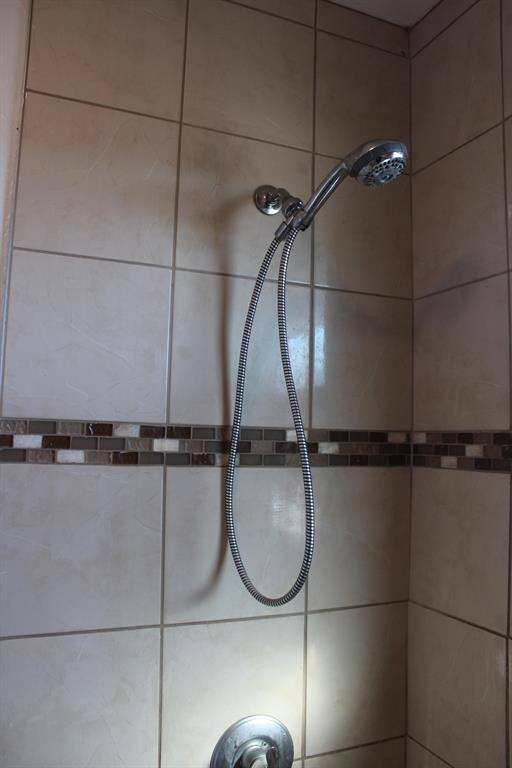 room details with a tile shower