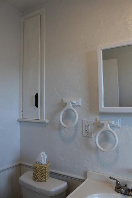 bathroom with toilet and sink