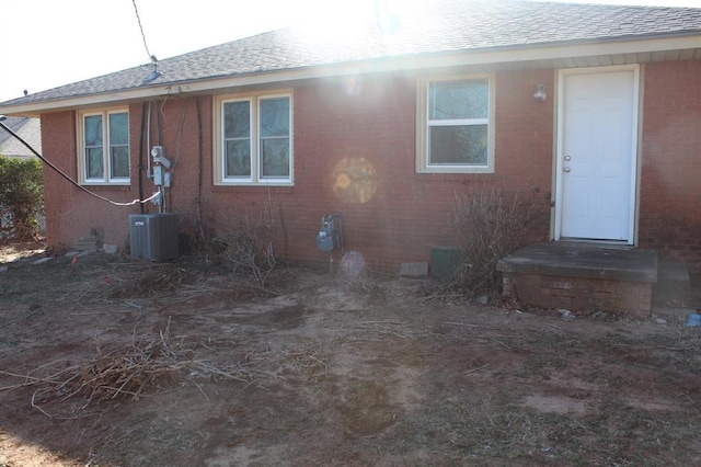 rear view of house with central AC