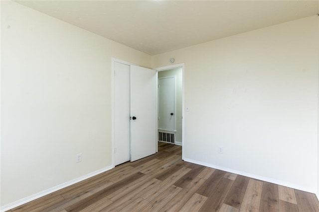 empty room featuring hardwood / wood-style floors