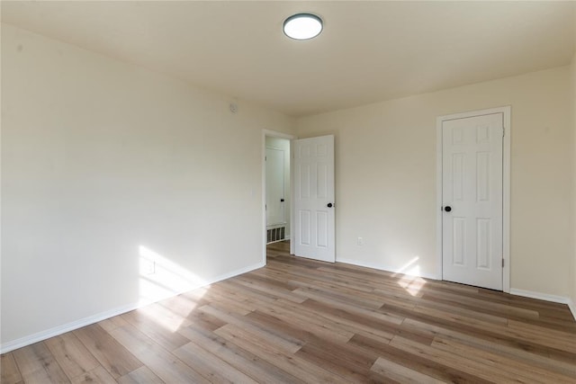 unfurnished room featuring light hardwood / wood-style floors