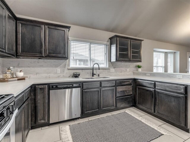 kitchen with plenty of natural light, a sink, stainless steel dishwasher, and gas stove