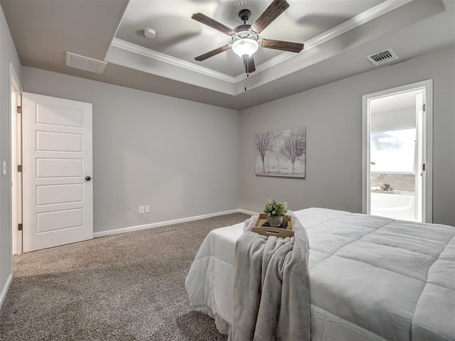 bedroom featuring carpet floors, a raised ceiling, visible vents, and ornamental molding