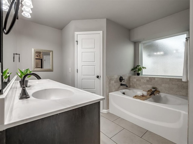 full bathroom with tile patterned flooring, a garden tub, a sink, and double vanity