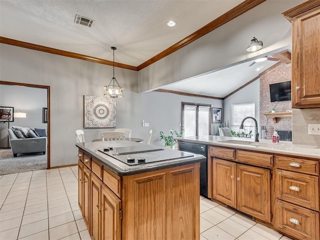 kitchen with sink, an inviting chandelier, hanging light fixtures, a kitchen island, and black appliances