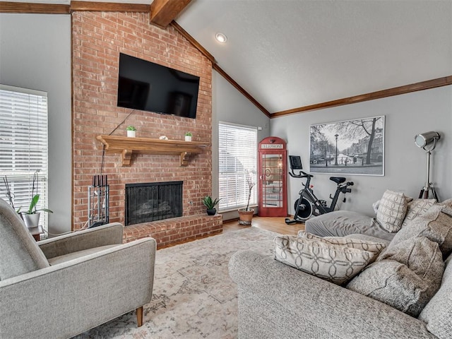 living room with wood-type flooring, lofted ceiling with beams, and a brick fireplace