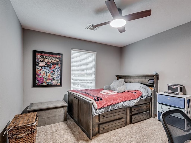 carpeted bedroom featuring ceiling fan