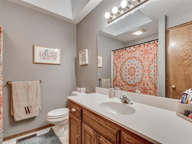 bathroom with tile patterned floors, toilet, and vanity