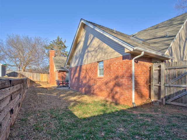 view of side of property featuring a patio area