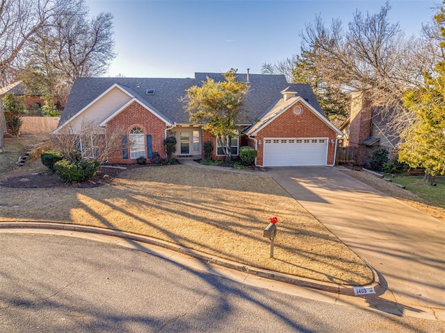 view of front of home featuring brick siding, driveway, an attached garage, and roof with shingles