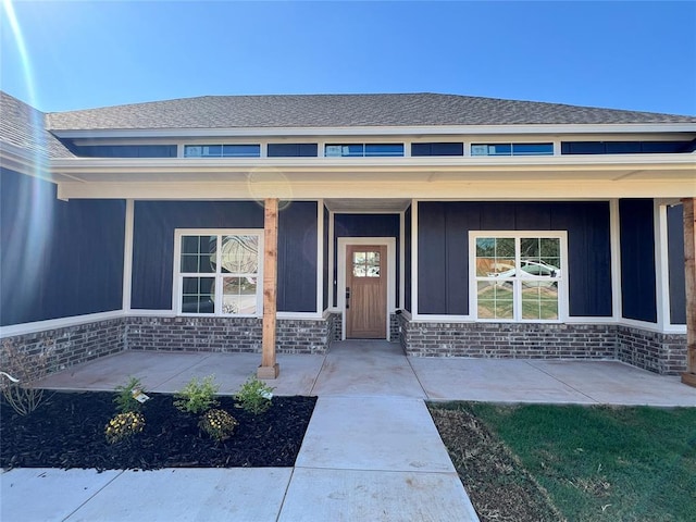 doorway to property with covered porch