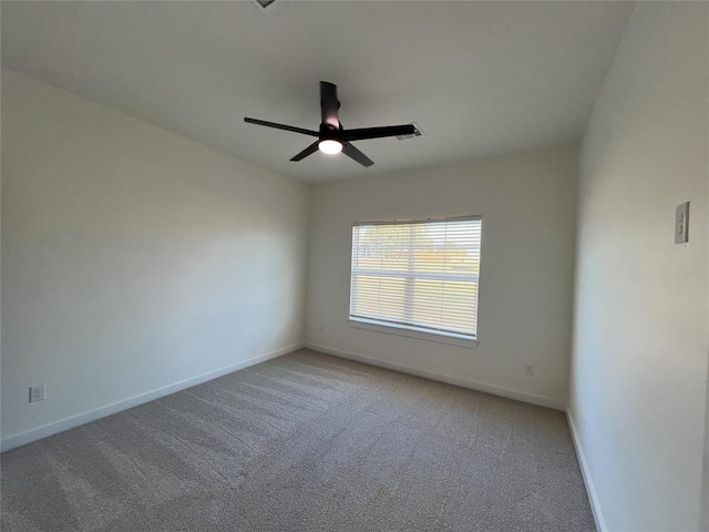 spare room featuring carpet flooring and ceiling fan