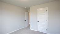 unfurnished bedroom with a closet