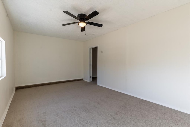 unfurnished room featuring ceiling fan and light colored carpet