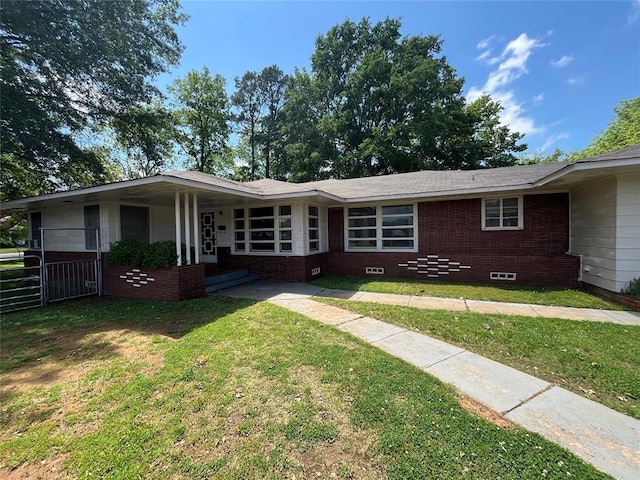 single story home with a front yard