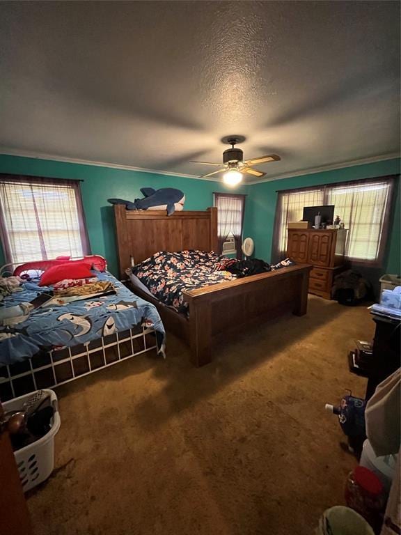 carpeted bedroom featuring a textured ceiling and ceiling fan