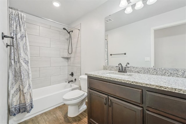 full bathroom featuring vanity, toilet, and shower / bath combo with shower curtain