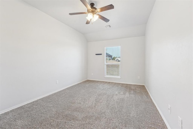 unfurnished room with carpet flooring, vaulted ceiling, and ceiling fan