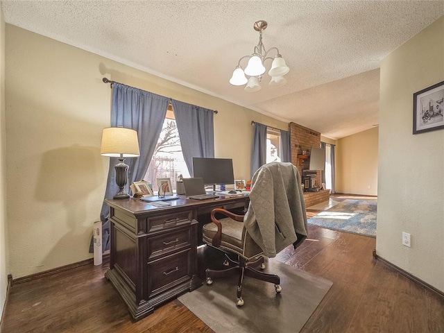 home office with an inviting chandelier, a textured ceiling, and dark hardwood / wood-style flooring