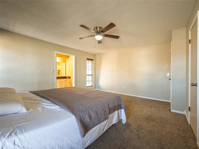 carpeted bedroom featuring ceiling fan, ensuite bathroom, and a textured ceiling