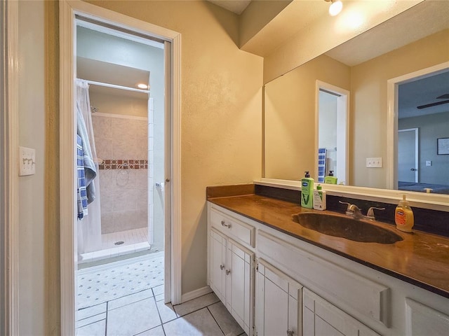 bathroom featuring a shower with curtain, tile patterned floors, and vanity