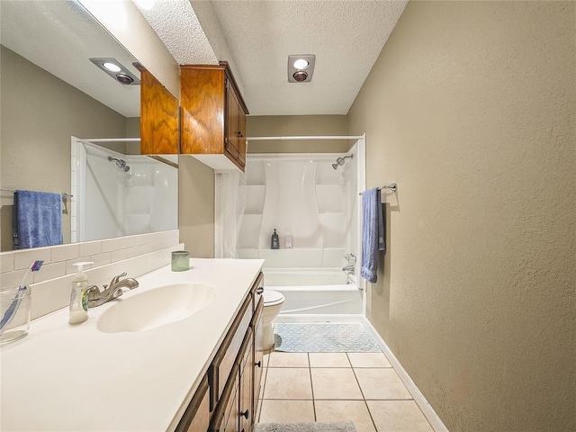 full bathroom with tub / shower combination, tile patterned flooring, toilet, a textured ceiling, and vanity