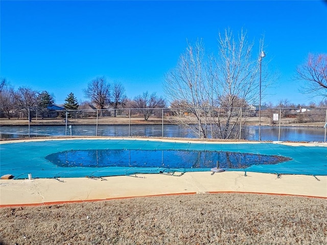 view of pool with a water view